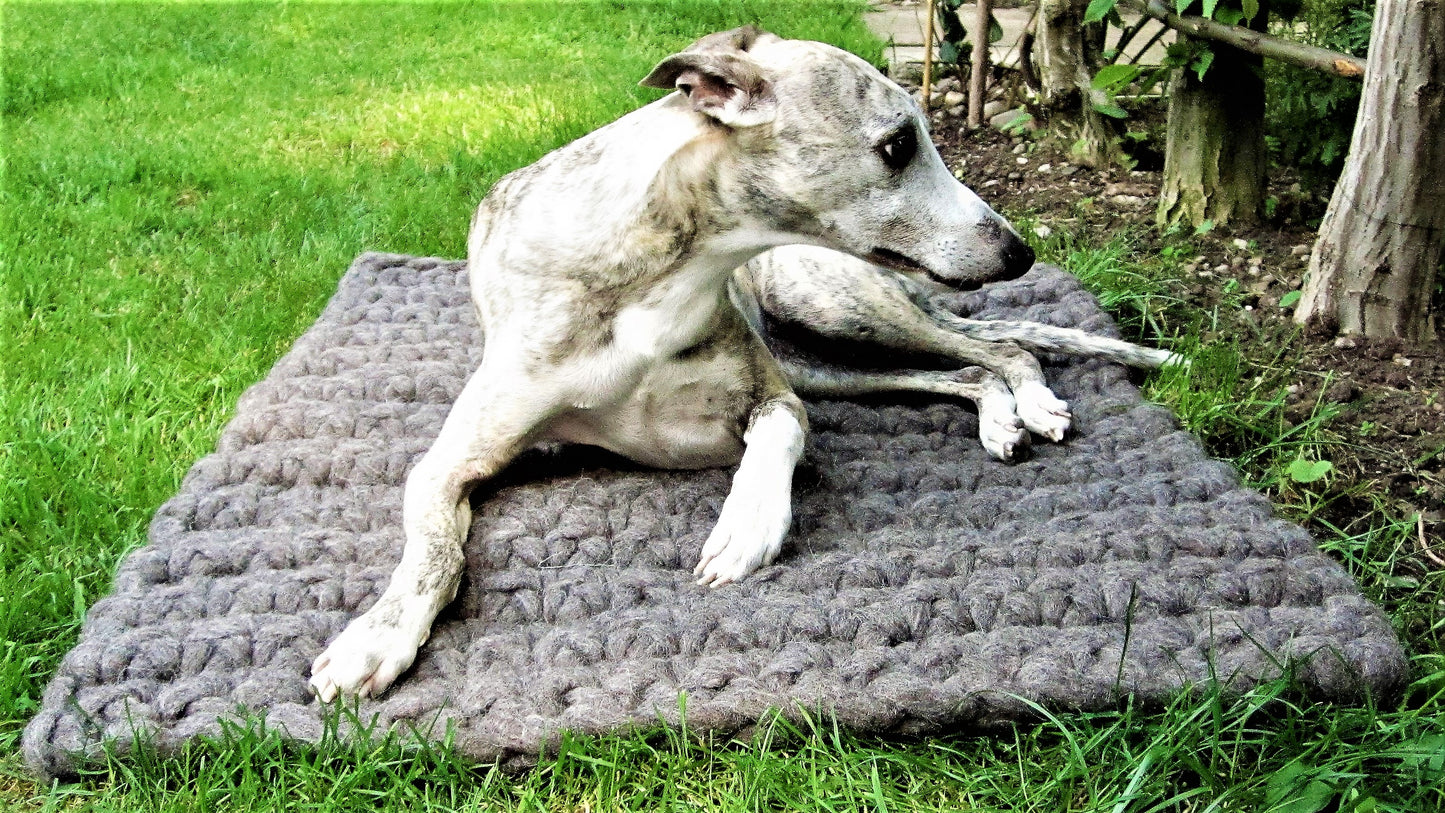 Felted dog mat made from virgin sheep's wool, carrying strap included