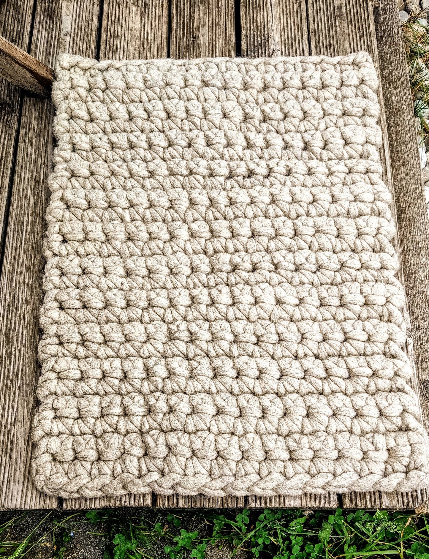 Felted dog mat made of sheep's wool, including carrying strap