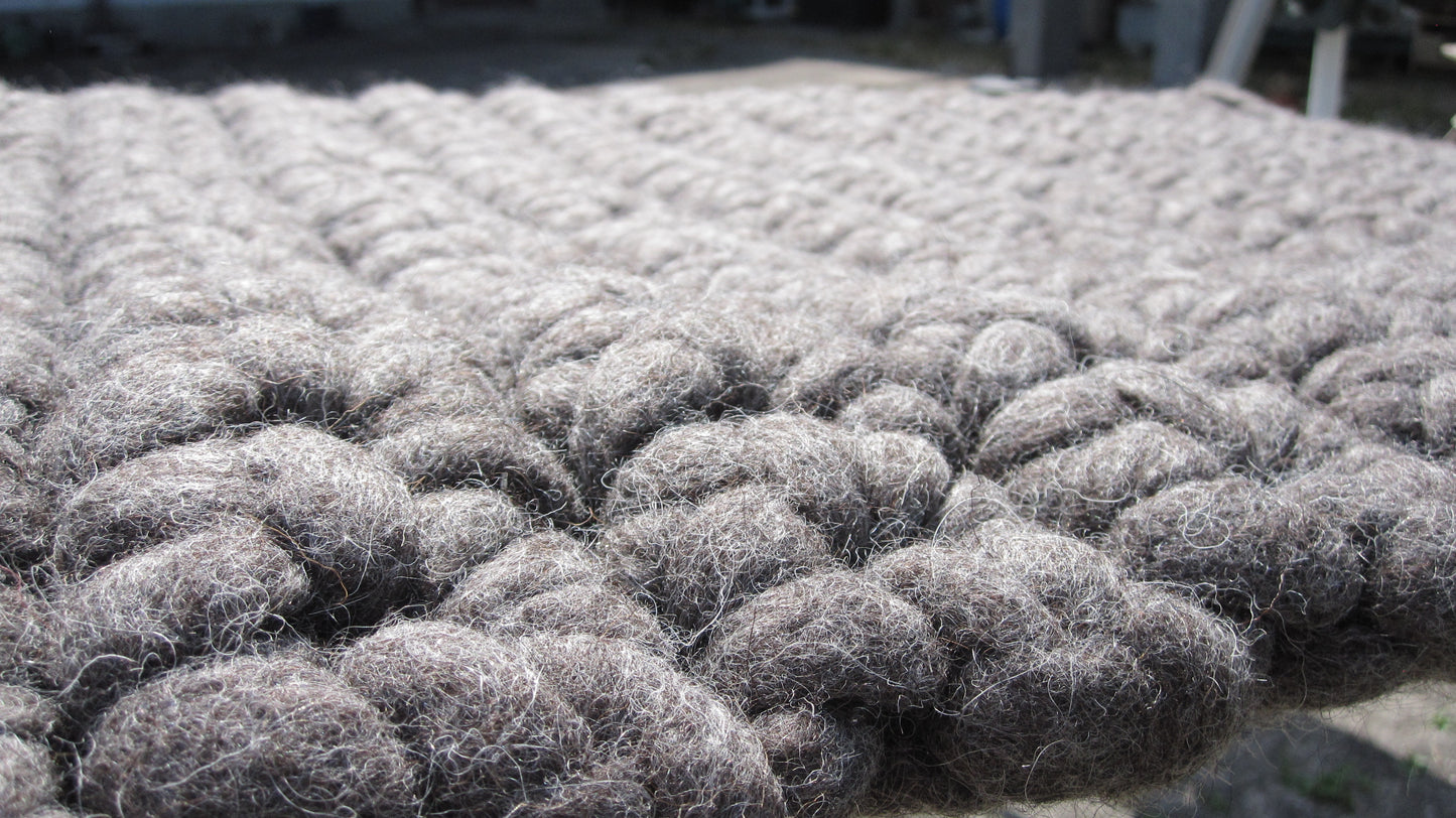 Felted dog mat made from virgin sheep's wool, carrying strap included